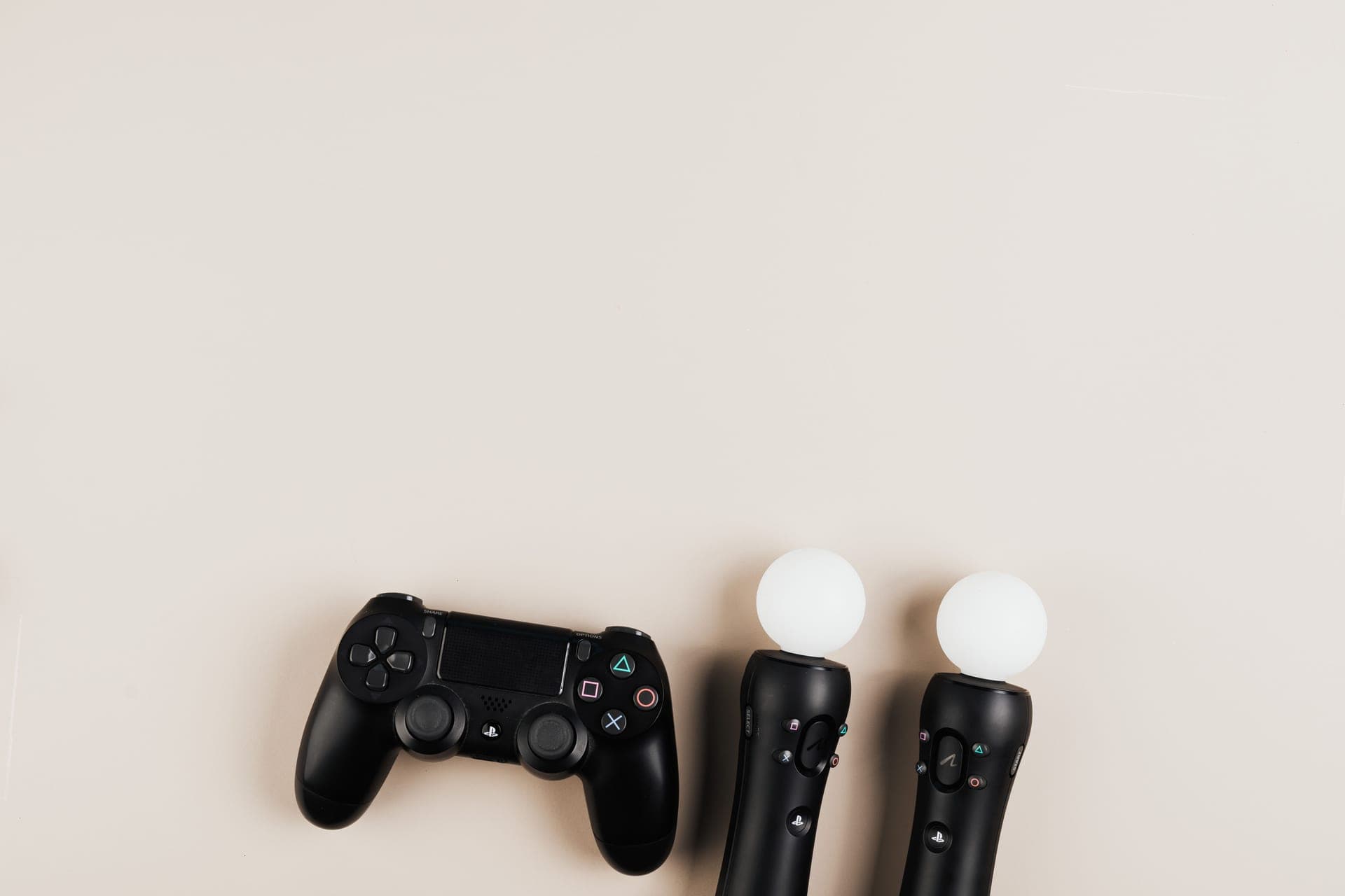 Game controllers arranged neatly on a bright yellow background