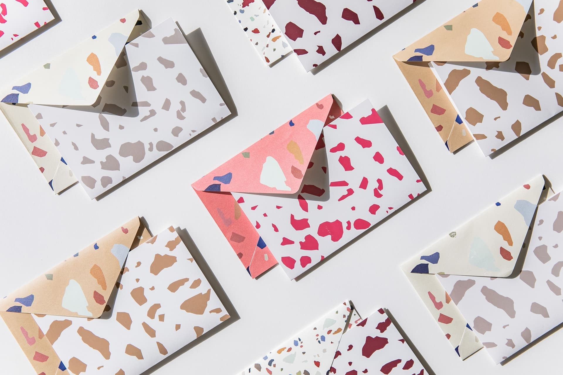 Colorful envelopes on a clean pastel background